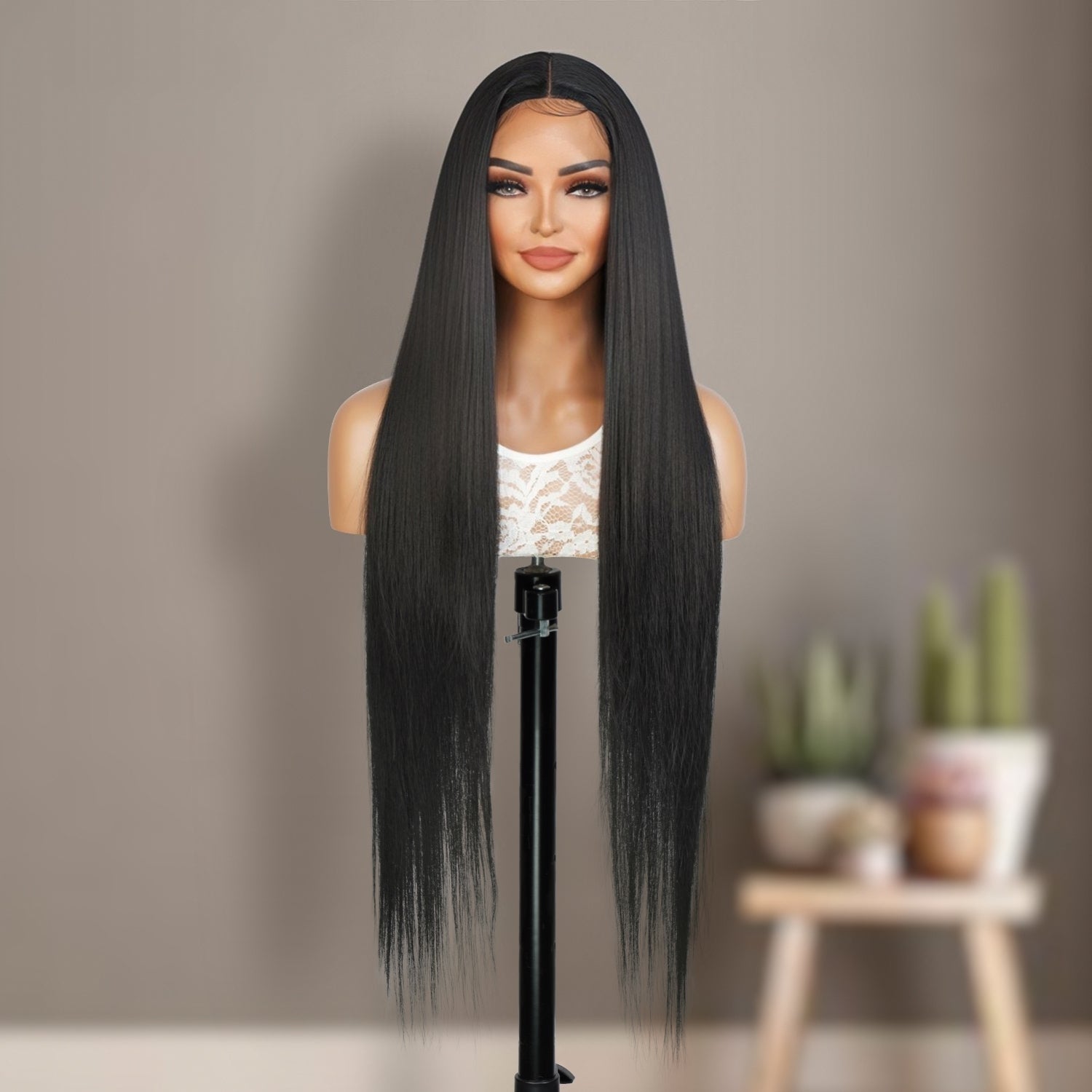 Introducing our stunning 36-inch waist-length straight Swiss lace front wig! Made with heat-resistant synthetic fibers, this wig offers a natural-looking hairline with a 4.5" deep middle center part design, perfect for black women. The soft Swiss lace front ensures comfort and security, while adjustable straps allow for a customizable fit. Elevate your style and enhance your beauty effortlessly with this must-have wig. Shop now for ultimate style and versatility!